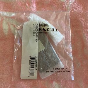 Coach Saddle Leather Stamped Star Hangtag. New in original packaging.